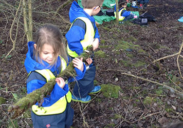 Exploring the forest with  at Lilliputs Day Nursery in Westhoughton