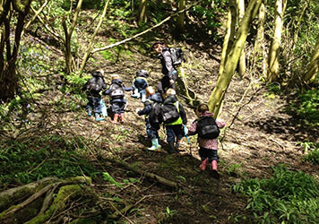 Exploring the forest with  at Lilliputs Day Nursery in Westhoughton