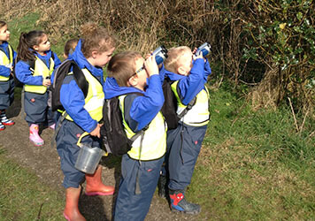 Exploring the forest with  at Lilliputs Day Nursery in Westhoughton