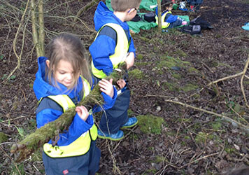 Exploring the forest with at Lilliputs Day Nursery in Westhoughton